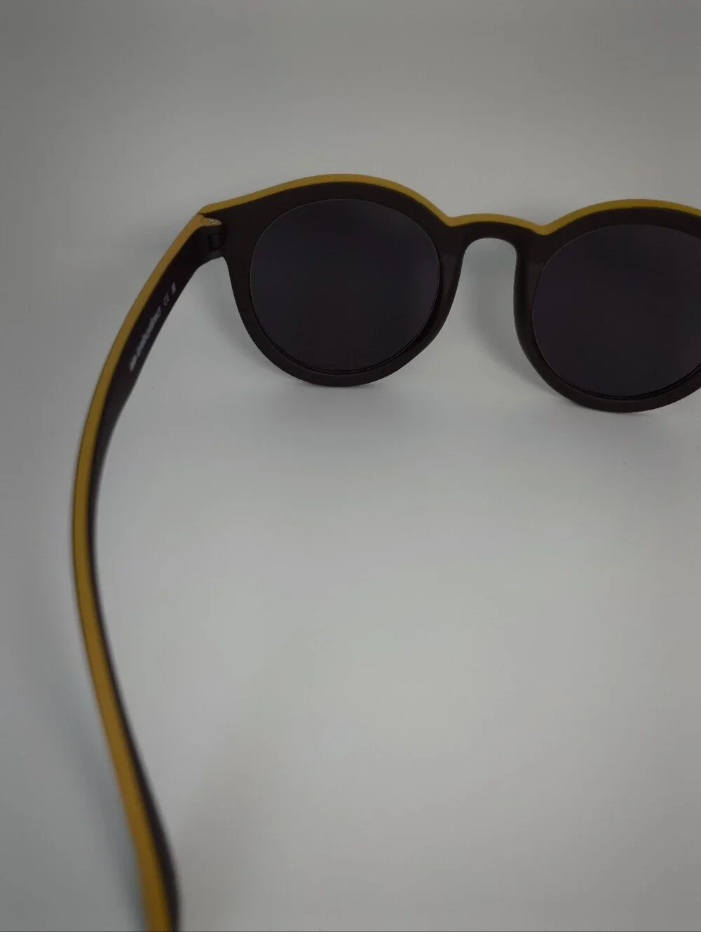Oasis. Men's Black Round Frame. Deep Chocolate, Yellow Top.